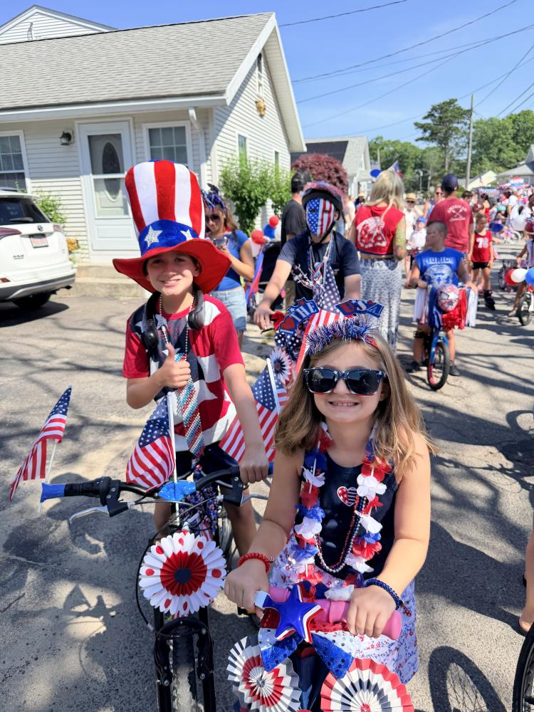 Residents ride through Swifts Beach for the annual Swifts Beach Improvement Association Fourth of July parade. Source: Christy Patalano