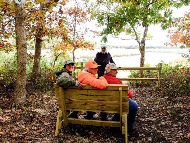 Land Trust members at the bench at Marks Cove Vista. File photo