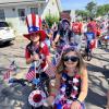 Residents ride through Swifts Beach for the annual Swifts Beach Improvement Association Fourth of July parade. Source: Christy Patalano